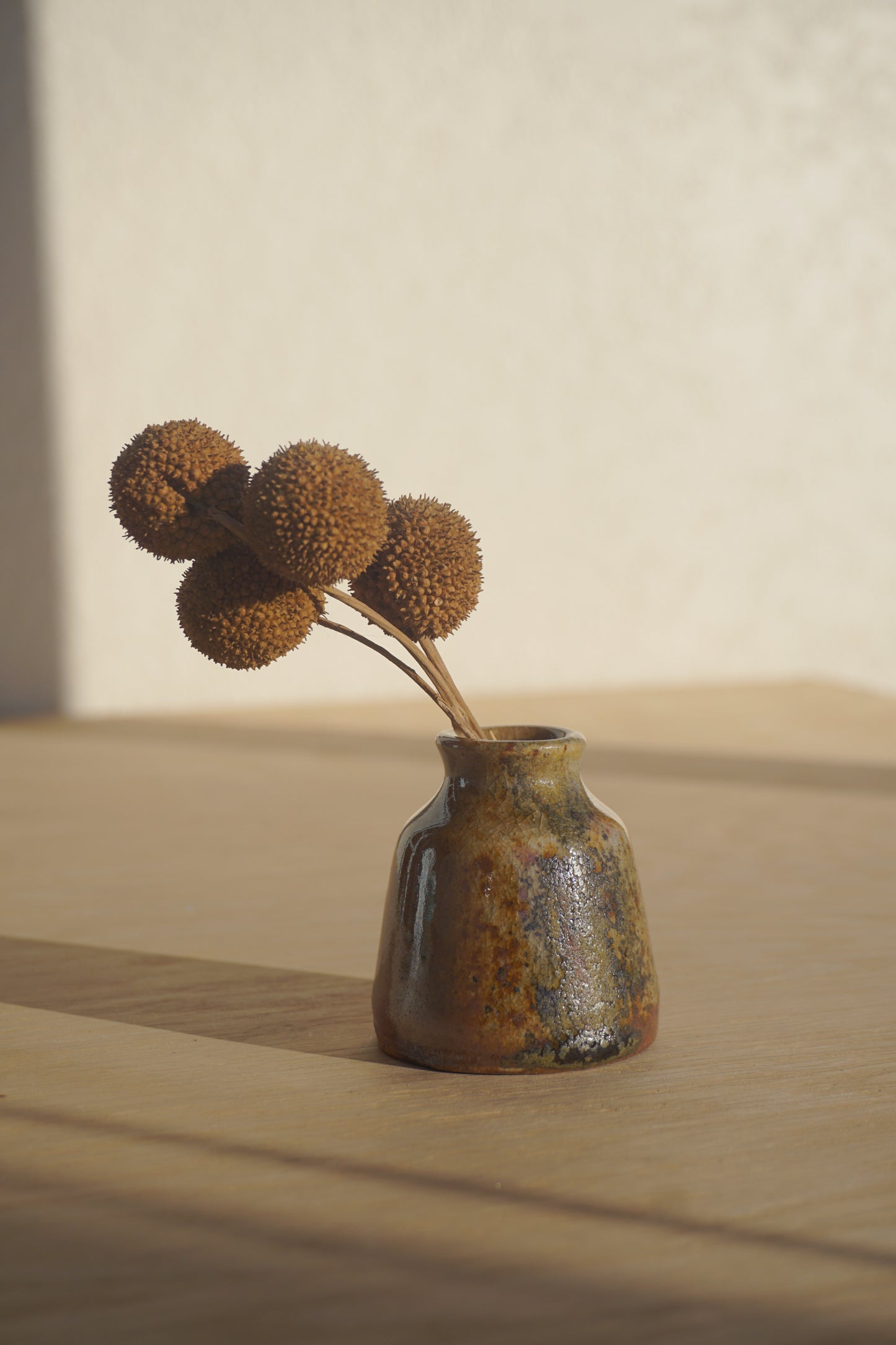 Small bud vase in gold shino