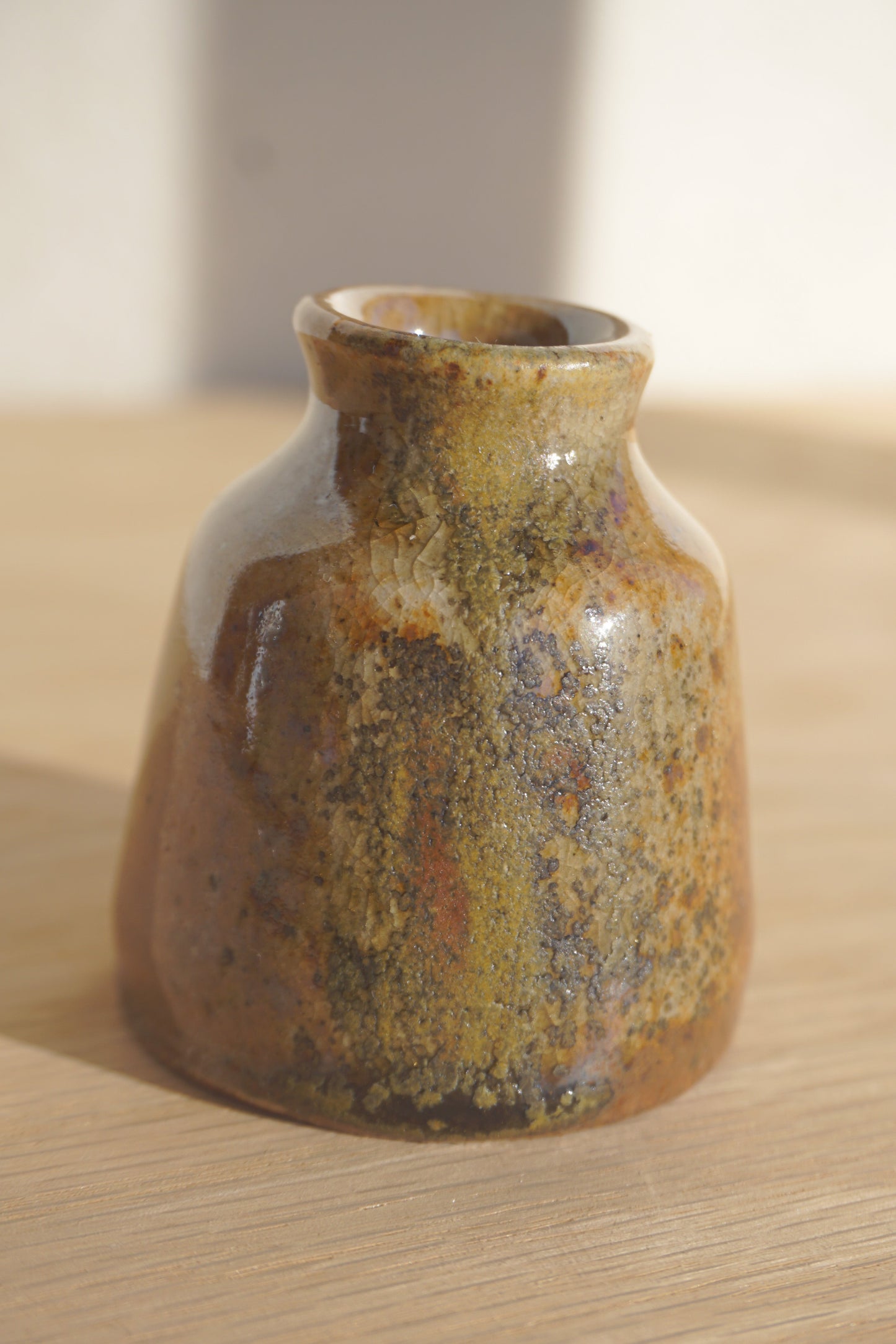 Small bud vase in gold shino