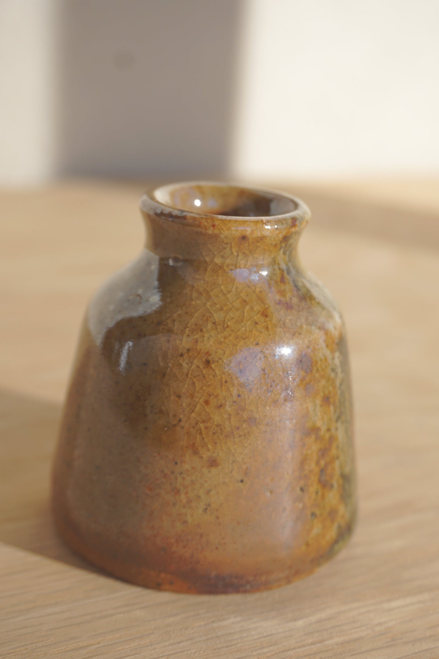 Small bud vase in gold shino